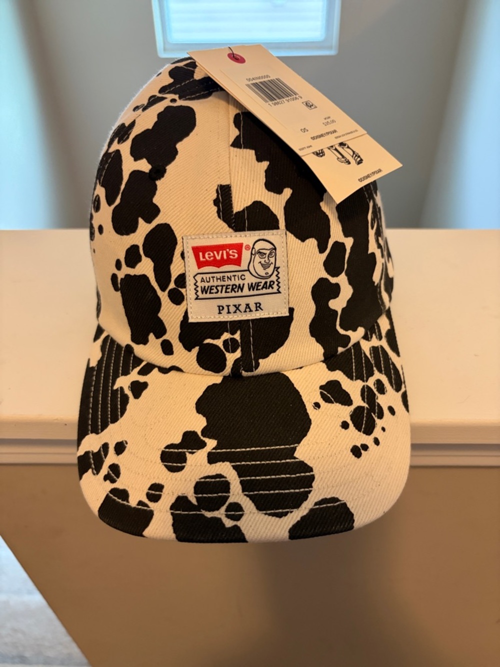 Levi's Black & White Cow Print Baseball Cap with Pixar Patch
